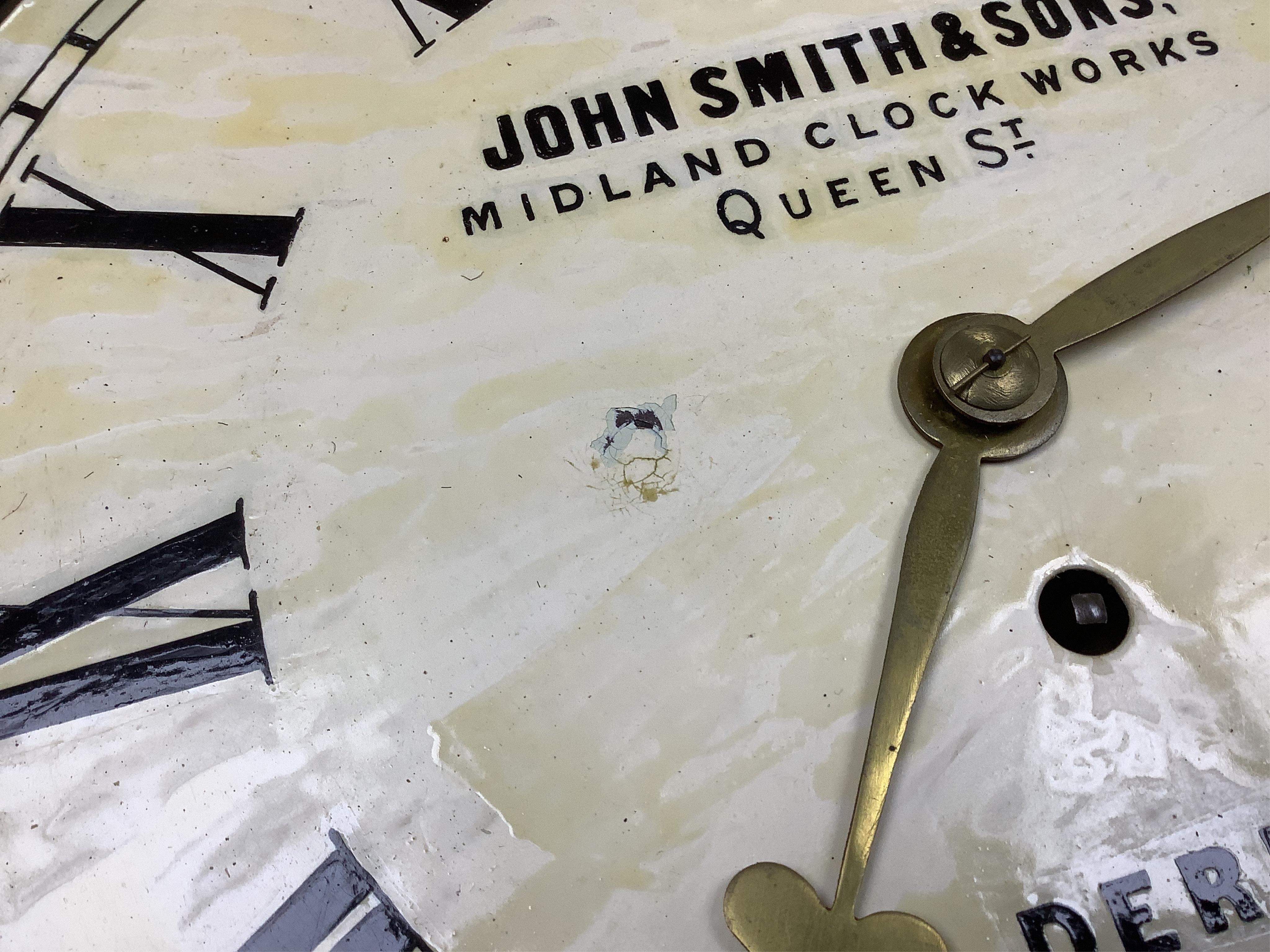 A John Smith & Sons of Derby oak wall clock, 39cm